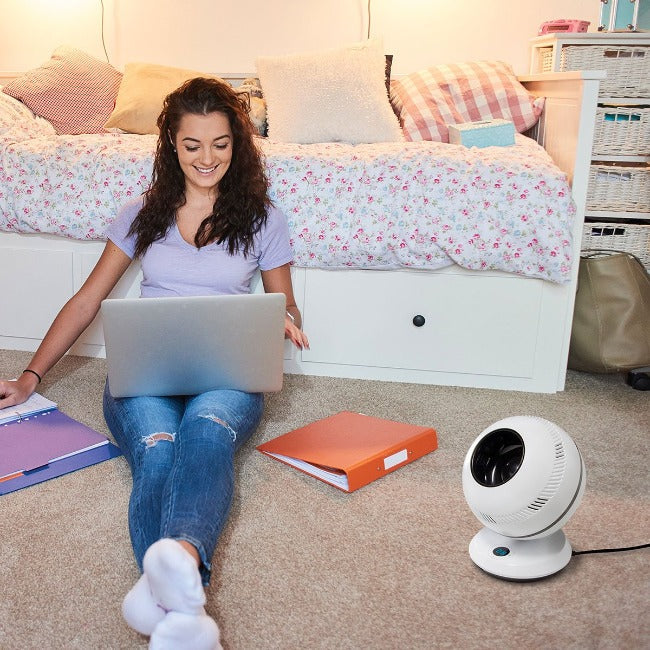 Girl does homework while using pureFlow QT7 bladeless fan 